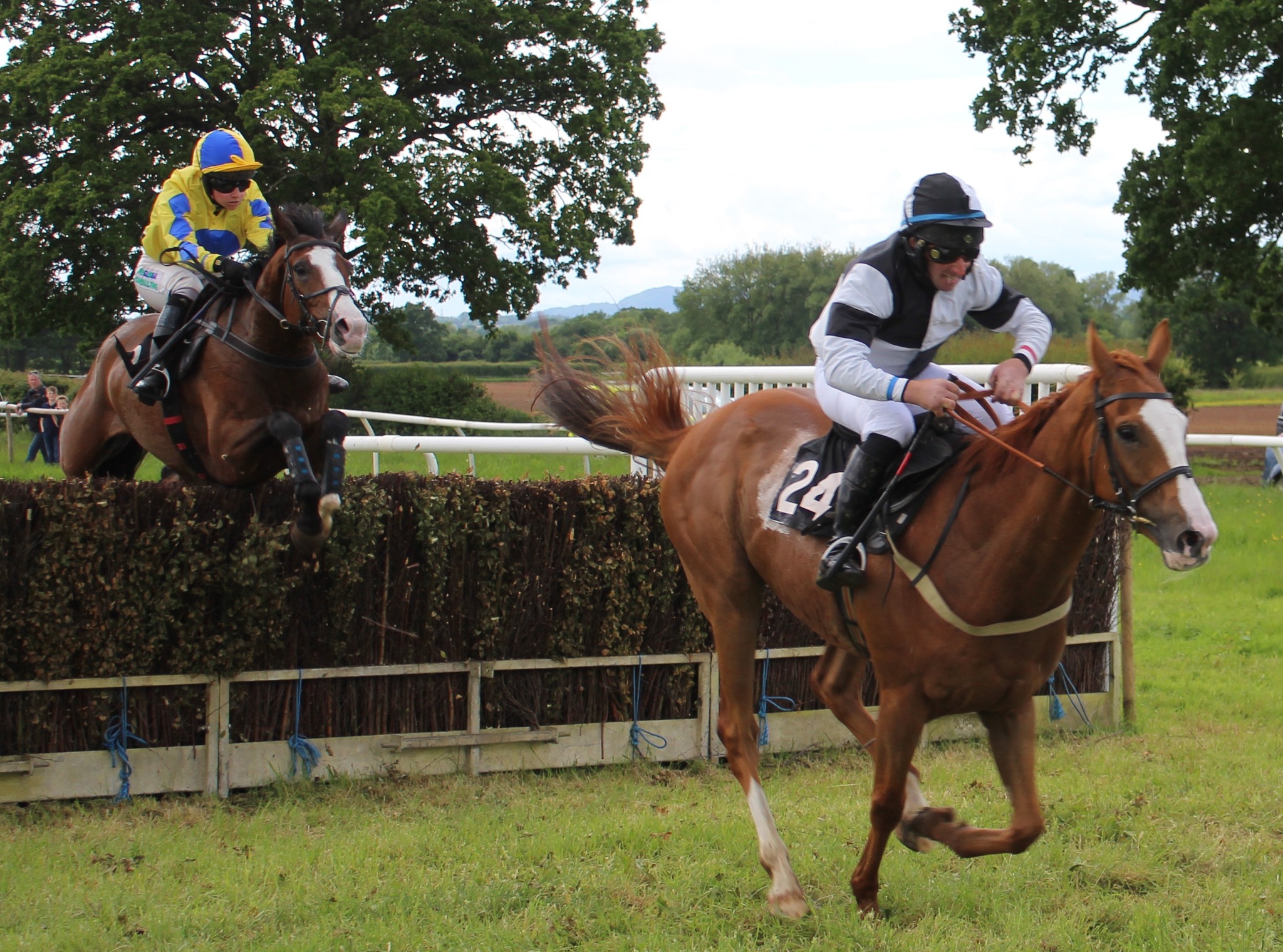 Billie Two Rivers (left) overhauls What's The Solution (Jack teal) at the last in the Restricted